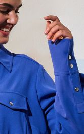 Як обробити розрізи рукавів із планками: класичний спосіб